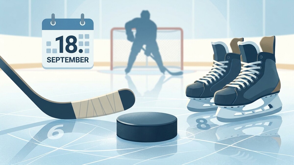 Eishockey-Puck, Schläger, Schlittschuhe und Kalenderblatt 18. September vor Tor