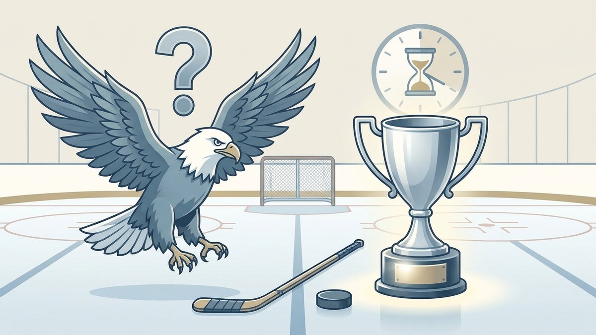 Adler fragt sich auf Eishockeyfeld vor Pokal und Tor, was zu sehen ist.
