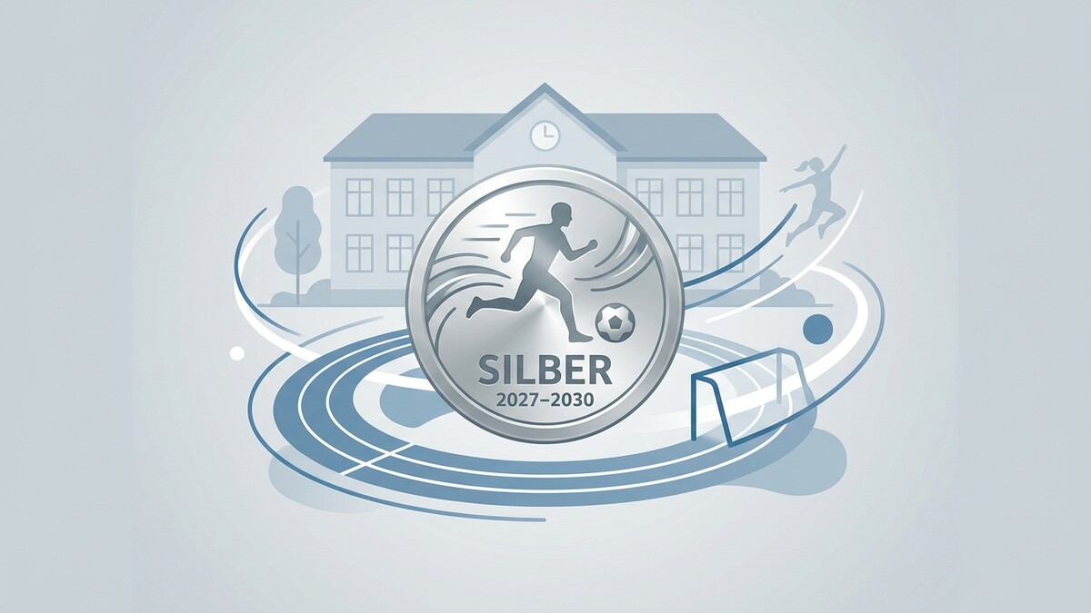 Silbermedaille mit Fußballer vor Schule, Leichtathletikbahn und Fußballtor